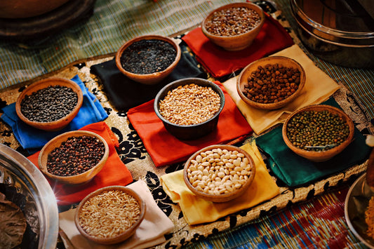 Colourful bowl of cooked beans, whole grains and seasonal vegetables showing healthy eating on a budget